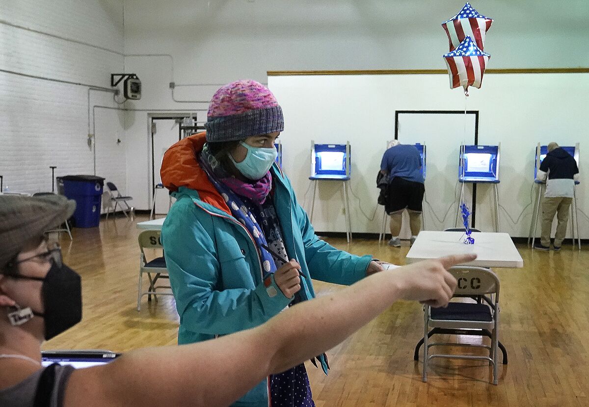 A voter gets directions from a poll worker in Minneapolis. 