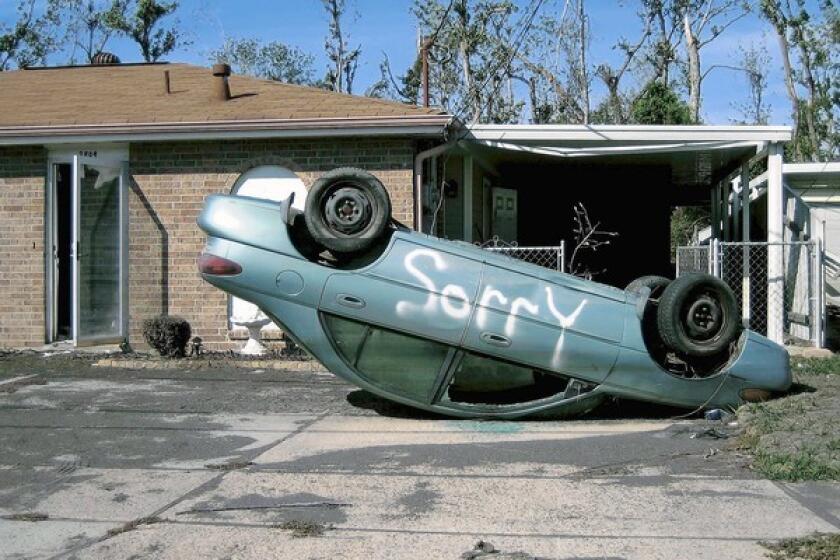 An upside-down car in New Orleans post-Hurricane Katrina.