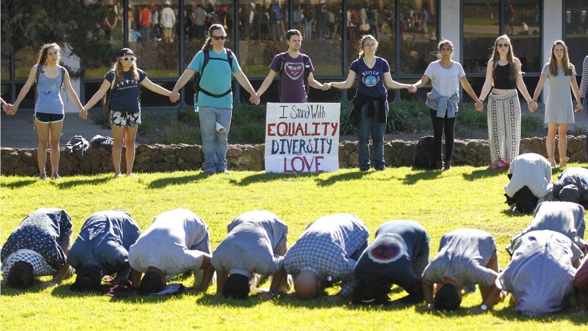 Muslim students prayed at UC San Diego as other students surrounded them in support on Monday, Jan. 30, 2017.