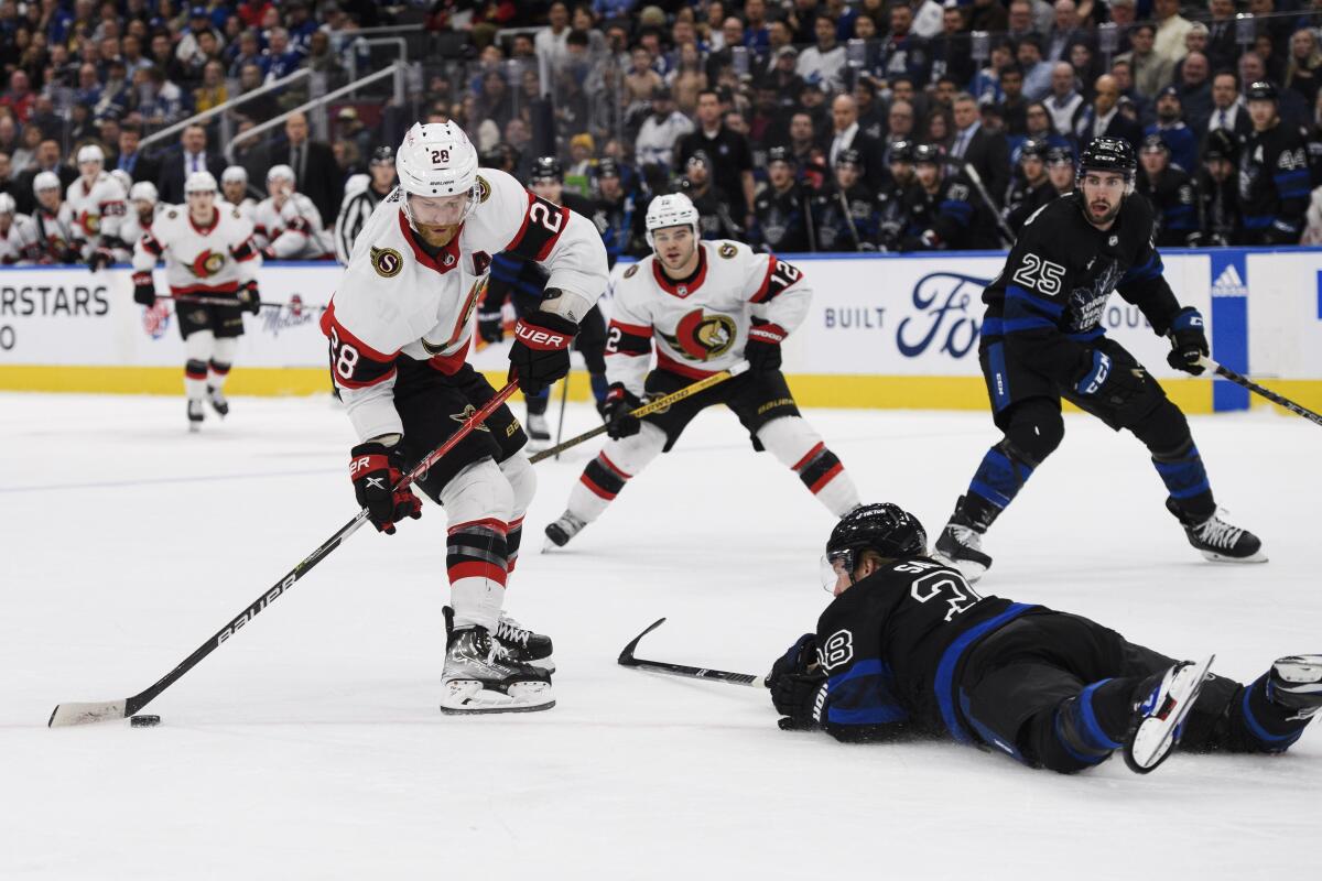 Ottawa Senators forward Claude Giroux (28) shoots on Toronto Maple Leafs goaltender Ilya Samsonov (35) while defenseman Rasmus Sandin (38) defends during the third period of an NHL hockey game, Friday, Jan. 27, 2023 in Toronto. (Christopher Katsarov/The Canadian Press via AP)