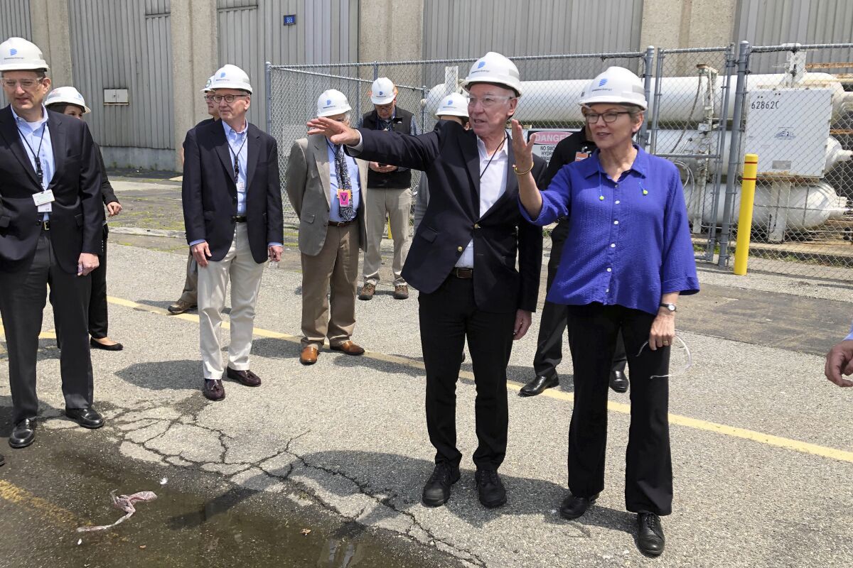 U.S. Energy Secretary Jennifer Granholm, right, and Democratic U.S. Rep. Joe Courtney, second from right, tour the Millstone Nuclear Power Station in Waterford, Conn., Friday, May 20, 2022. They are both working to change how spent nuclear fuel is stored nationwide to solve a decades long stalemate. (AP Photo/Jennifer McDermott)