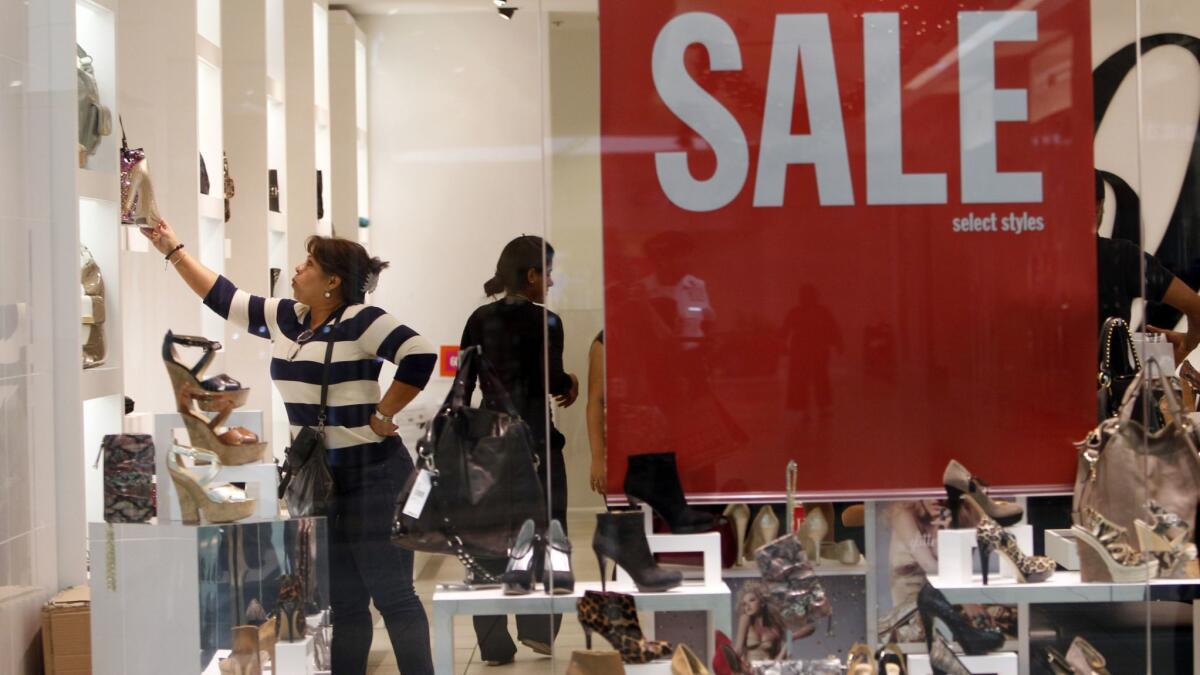 People shop for shoes at a Nine West store in 2011.