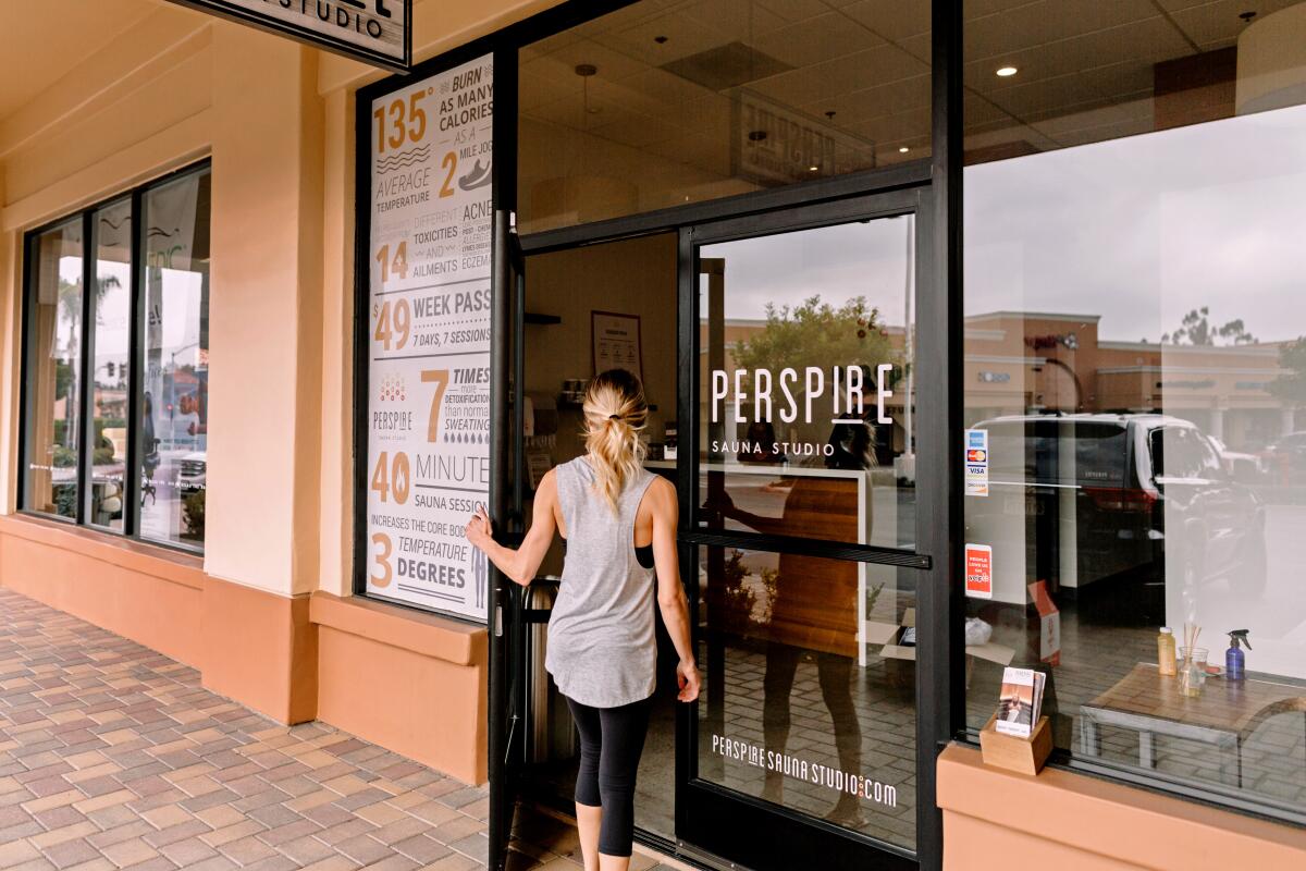 A person is outside the Perspire Sauna Studio in Laguna Niguel. 