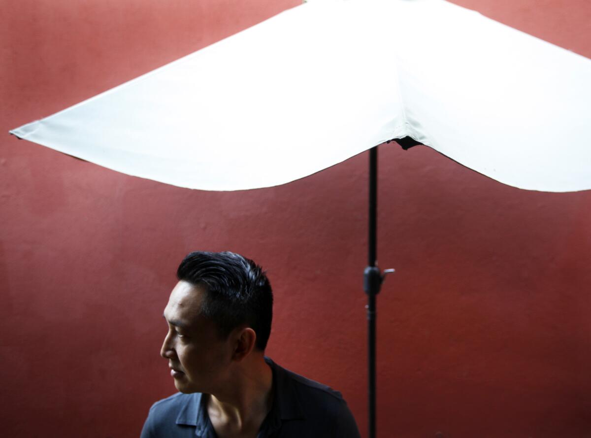 Author Viet Thanh Nguyen on the patio at his home.