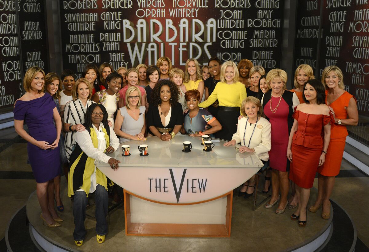 On May 15, her final day as cohost of "The View," Barbara Walters, seated right, was saluted by Oprah Winfrey, center, her fellow hosts and two dozen female broadcasters.
