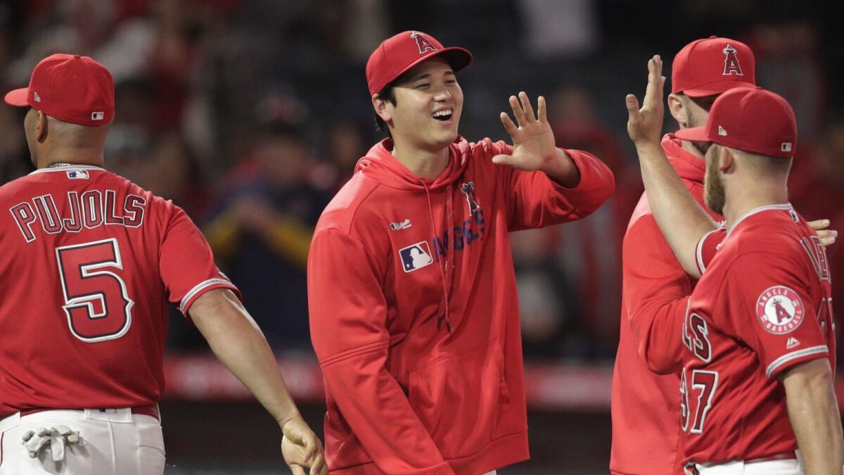 Shohei Ohtani celebrates the Angels' 3-1 over the Texas Rangers on Friday night.