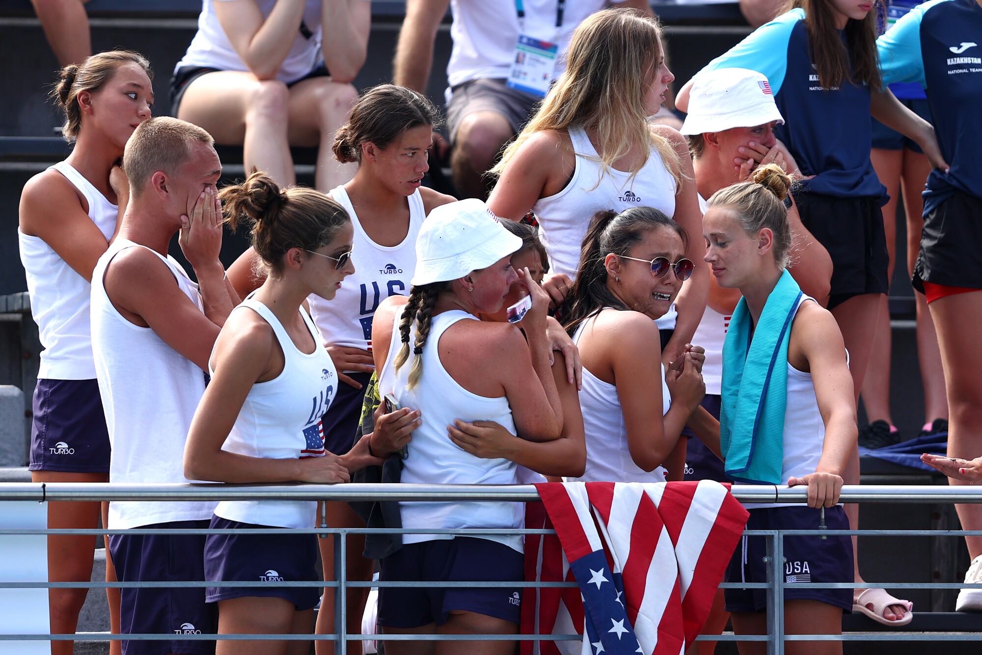 Members of Team United States react as Anita Alvarez is attended to by medical staff 