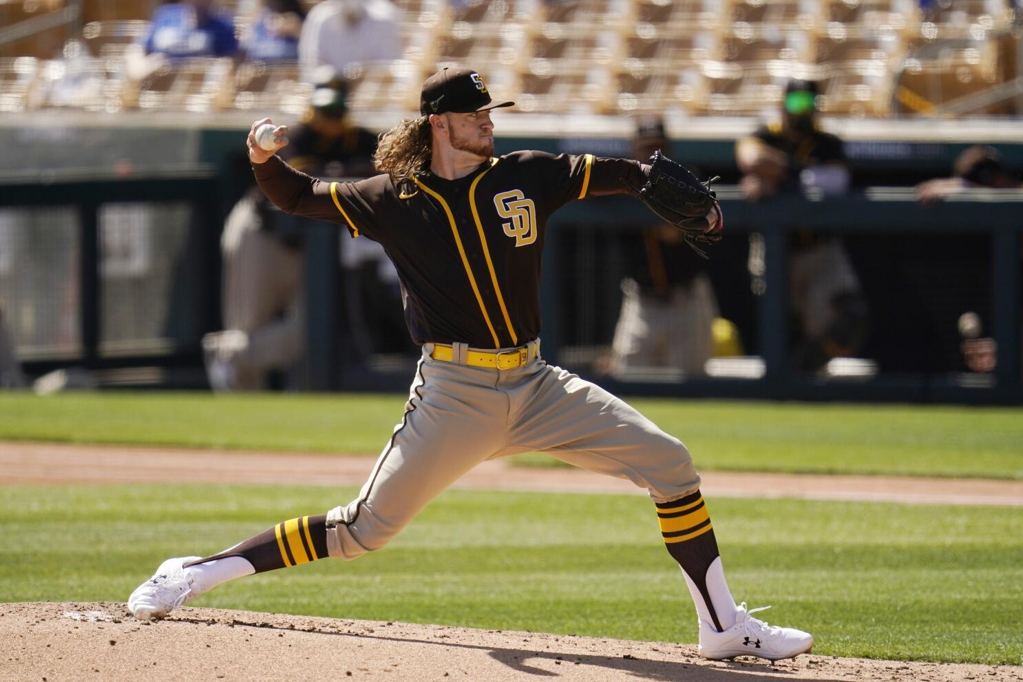 San Diego Padres' Manny Machado strikes out against the San Francisco  Giants during the second inning of a spring training baseball game,  Saturday, March 2, 2019, in Peoria, Ariz. (AP Photo/Matt York