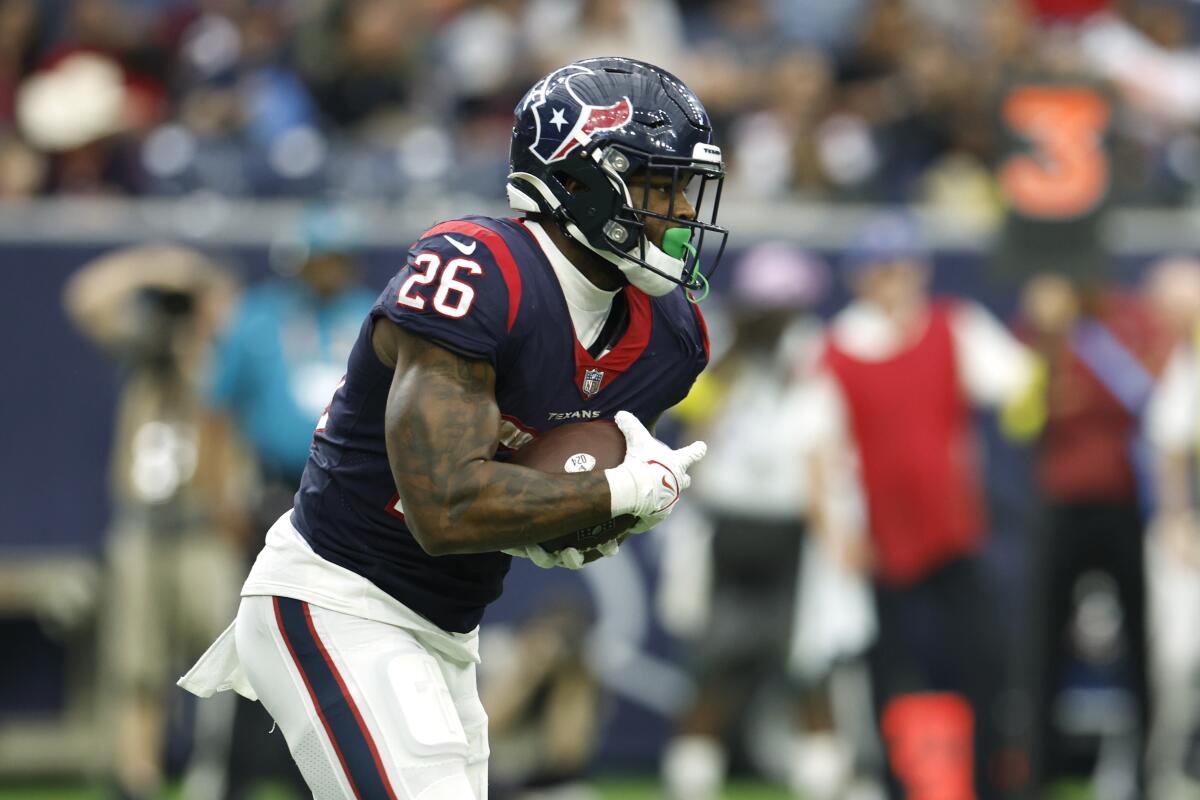 Texans running back Royce Freeman looks for room to run during a game last season in Houston.