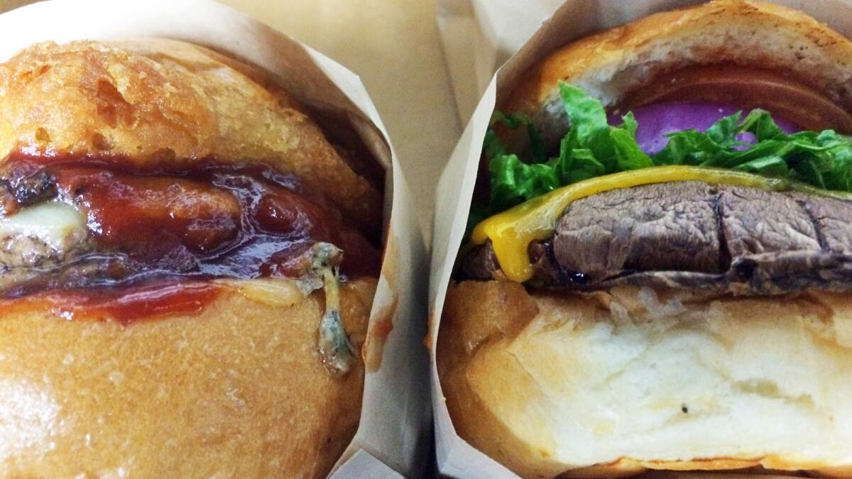 Two burgers from Vaka Burger, a stand inside a liquor store in Boyle Heights.