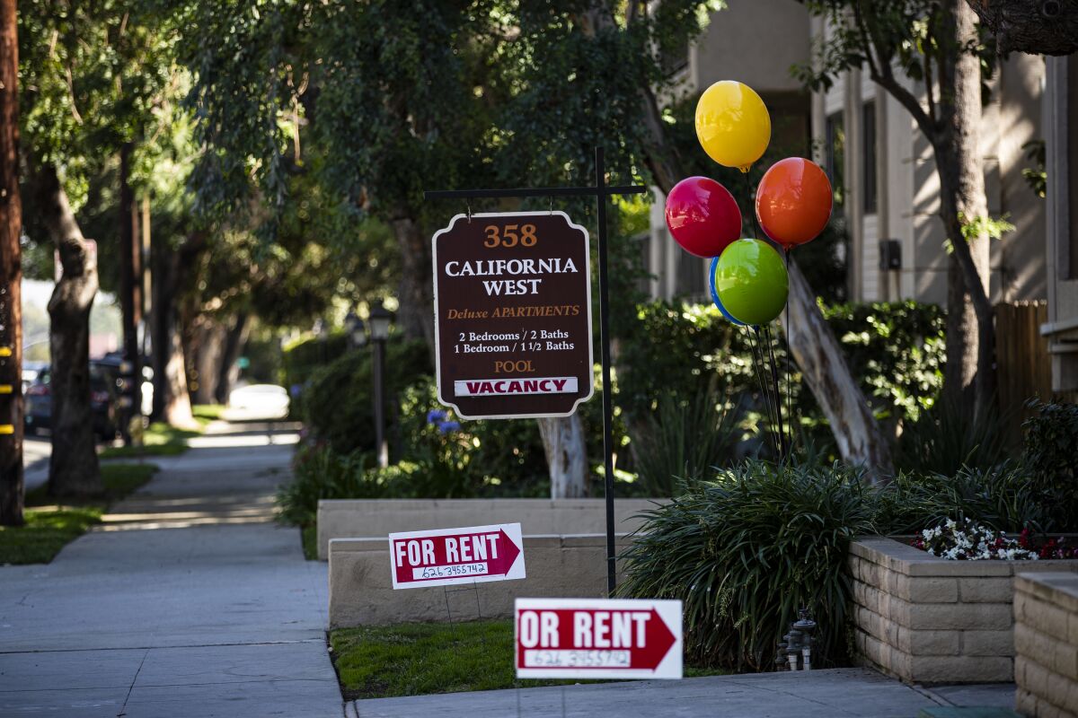 Signs and balloons advertise apartments for rent in Pasadena in 2019.