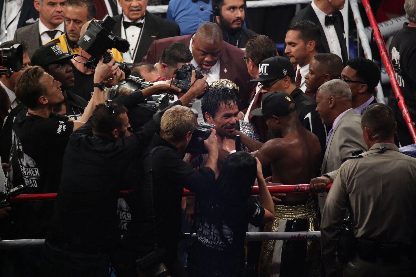 Floyd Mayweather Jr. and Manny Pacquiao talk in the ring Saturday following their "Fight of the Century."