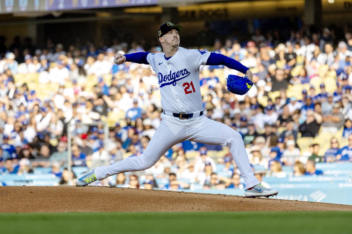 Walker Buehler pitches from the mound.