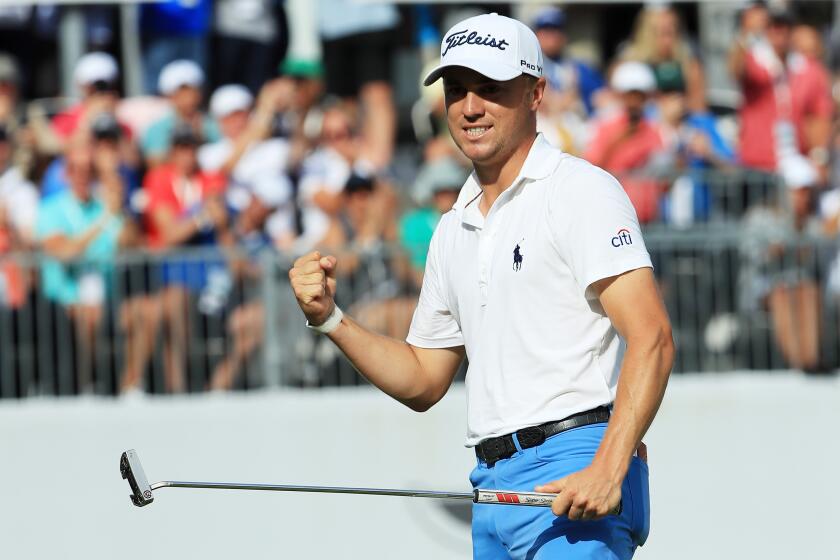 MEDINAH, ILLINOIS - AUGUST 18: Justin Thomas of the United States celebrates on the 18th green after winning during the final round of the BMW Championship at Medinah Country Club No. 3 on August 18, 2019 in Medinah, Illinois. (Photo by Sam Greenwood/Getty Images)
