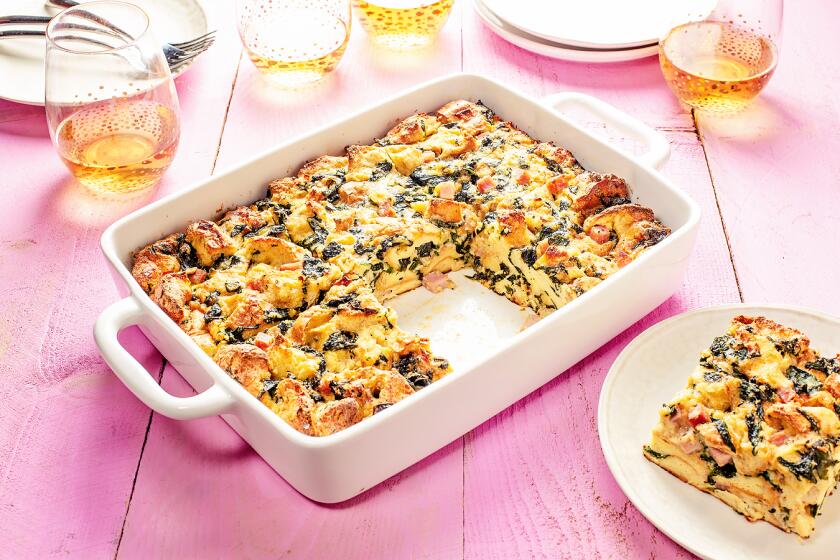 The essential ingredients for overnight egg bakes are eggs, milk, cheese and bread. After that, these casseroles are entirely customizable. This brunch casserole is dotted with caramelized onions, spinach and diced ham.