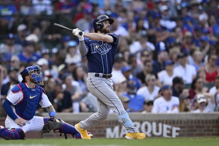 Tampa Bay Rays Brandon Lowe (8) hits a two run home run in the seventh inning of a baseball game against the Chicago Cubs on Wednesday, May 31, 2023, in Chicago. (AP Photo/Quinn Harris)