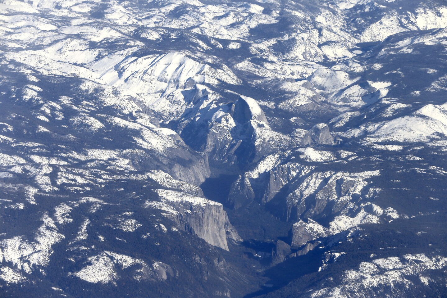 An aerial view shows the snowpack in the Sierra Nevada Mountains and Yosemite National Park