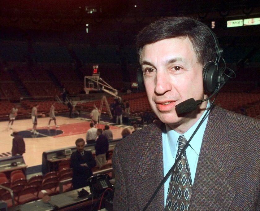 FILE - Marv Albert poses at Madison Square Garden in New York, in this Sunday, Feb. 7, 1999, file photo, where he broadcast the Knicks season home opener against the Miami Heat for WFAN radio. Marv Albert plans to retire following the NBA's Eastern Conference finals, ending a broadcasting career that has spanned nearly 60 years. “There is no voice more closely associated with NBA basketball than Marv Albert’s,” NBA Commissioner Adam Silver said in a statement released Monday, May 17, 2021, by Turner Sports.(AP Photo/Ron Frehm, File)
