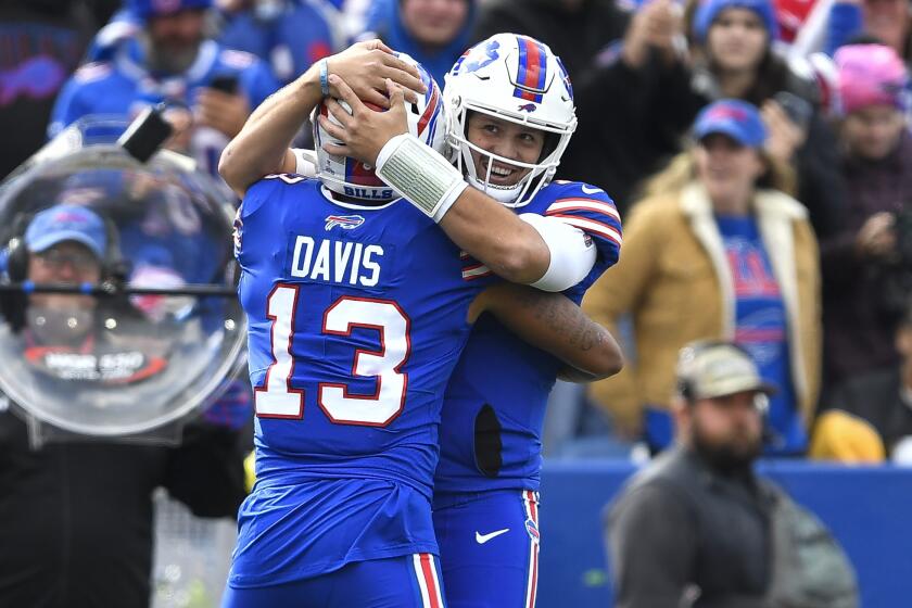 Buffalo Bills wide receiver Gabe Davis (13) celebrates with quarterback Josh Allen (17) after scoring a touchdown against the Pittsburgh Steelers during the first half of an NFL football game in Orchard Park, N.Y., Sunday, Oct. 9, 2022. (AP Photo/Adrian Kraus)