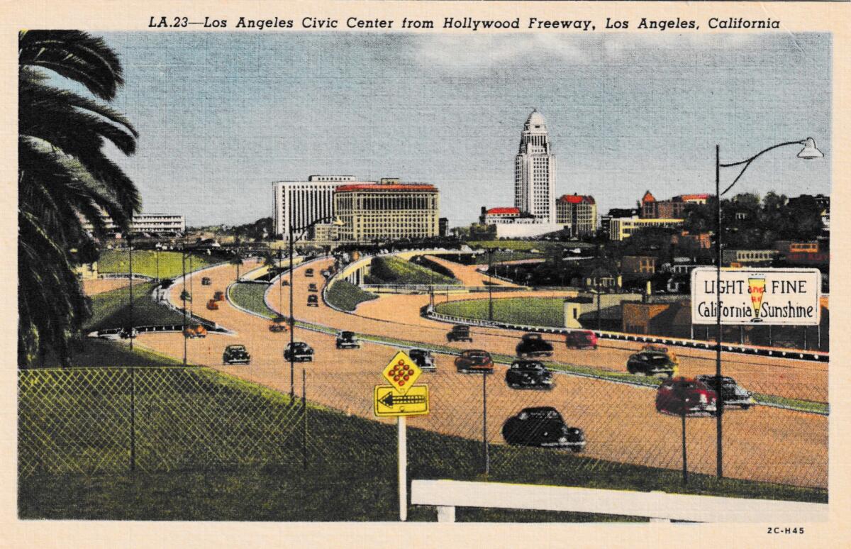A historic postcard showing the Hollywood Freeway and downtown Los Angeles.