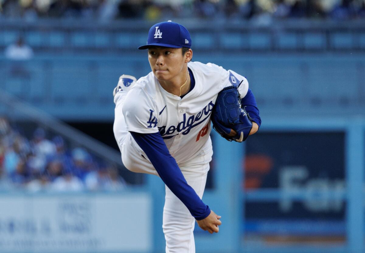 Dodgers starter Yoshinobu Yamamoto follows through on a pitch Saturday night.
