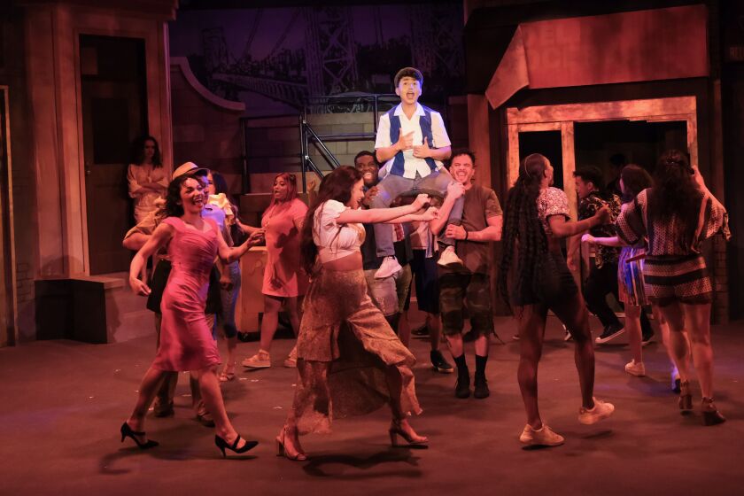Sebastian Montenegro as Usnavi, top, leads the cast of San Diego Musical Theatre's "In the Heights."