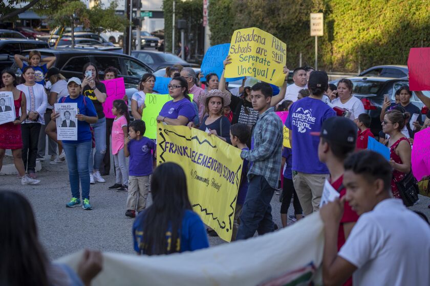 PASADENA, CALIF. -- THURSDAY, OCTOBER 24, 2019: Protestors rally outside the Pasadena Unified School Board meeting after marching from Pasadena City Hall. The Pasadena Unified School Board was voting Thursday on whether to close some middle and/or high schools because of declining enrollment. The group protested outside the meeting. Photo taken in Pasadena, Calif., on Oct. 24, 2019. (Allen J. Schaben / Los Angeles Times)