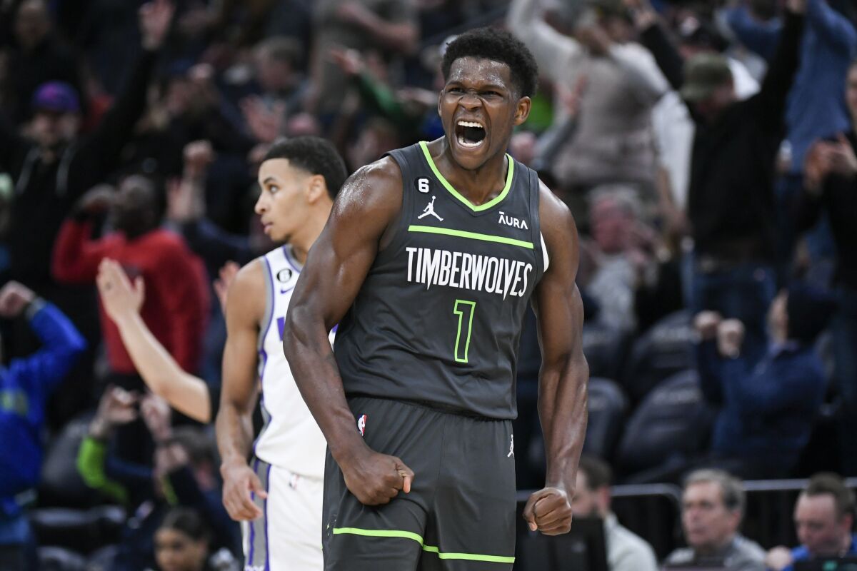 Minnesota Timberwolves guard Anthony Edwards reacts after making a 3-point shot against the Sacramento Kings during the second half of an NBA basketball game Saturday, Jan. 28, 2023, in Minneapolis. (AP Photo/Craig Lassig)