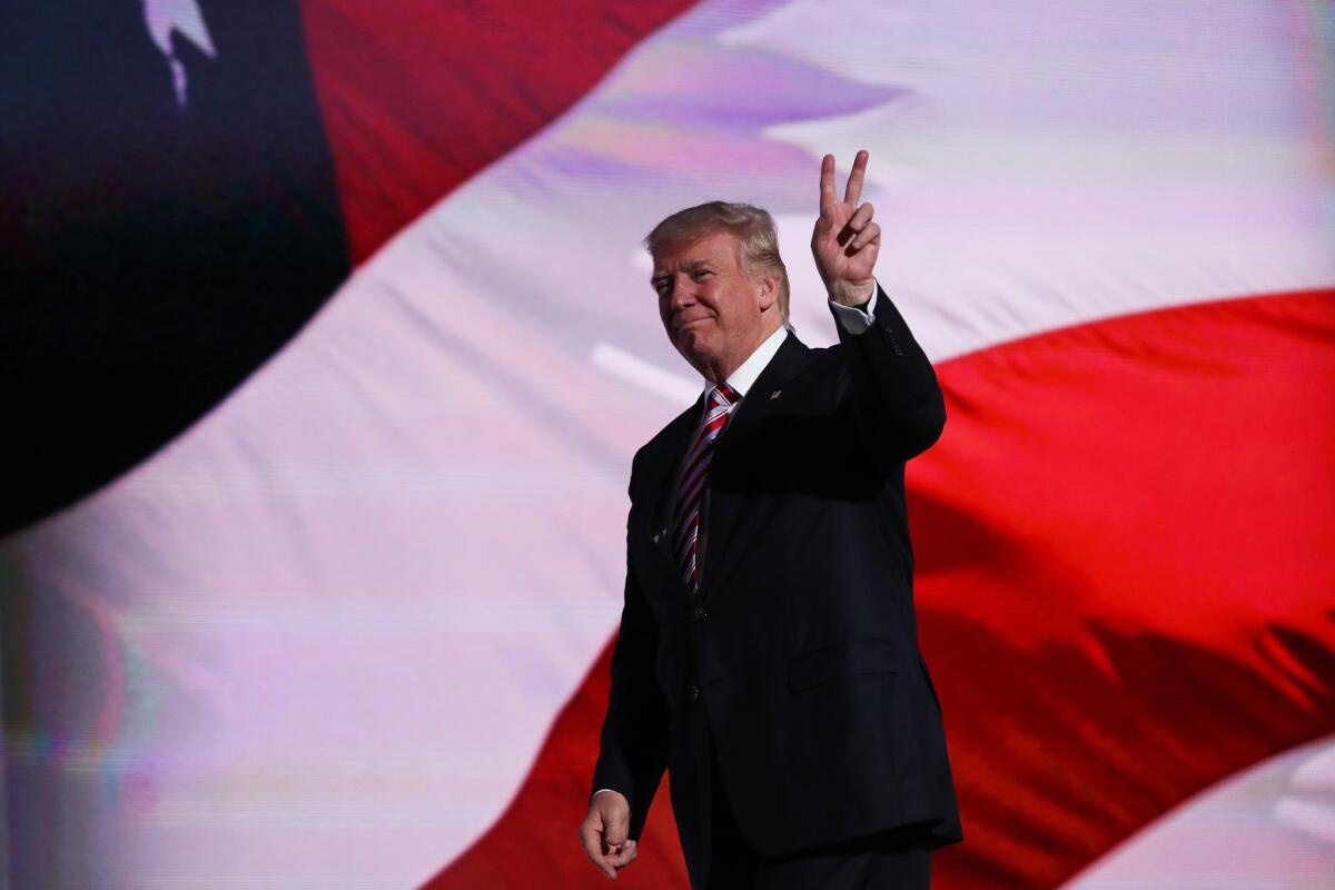 Republican presidential candidate Donald Trump gestures after vice presidential candidate Mike Pence delivered his speech on the third day of the Republican National Convention in Cleveland.