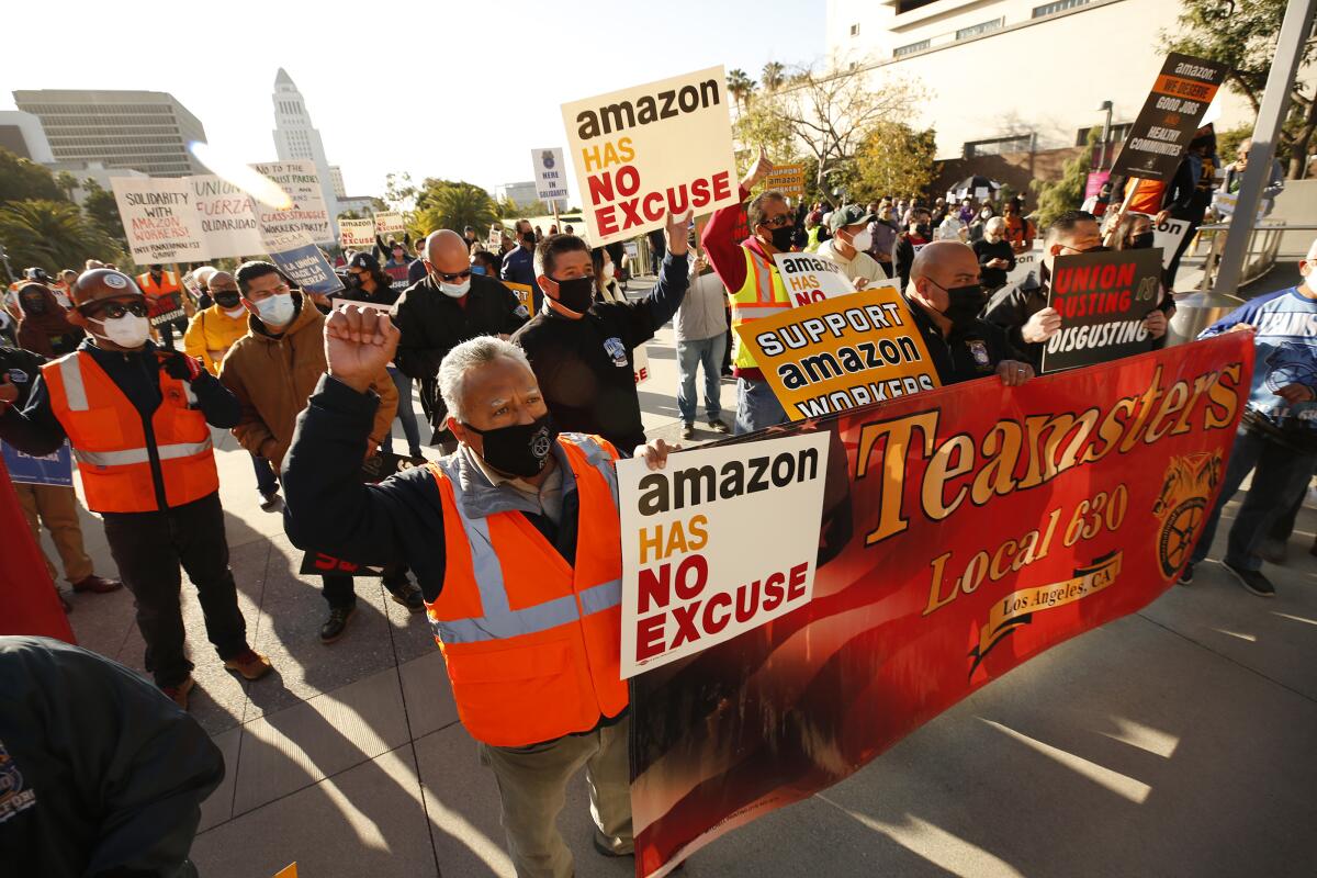 Workers rallied in downtown Los Angeles on to support unionizing Amazon warehouse employees.