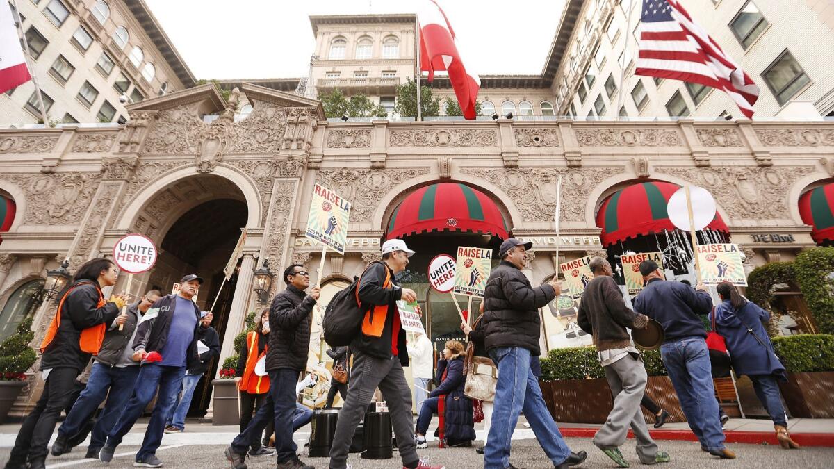 Hotel workers from Unite Here Local 11 demonstrate in front of the Beverly Wilshire on Wednesday.
