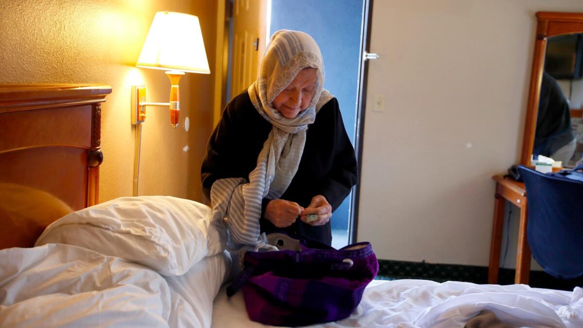 Marzieh Moosavizadeh packs in her hotel room in El Segundo after she was detained at LAX.