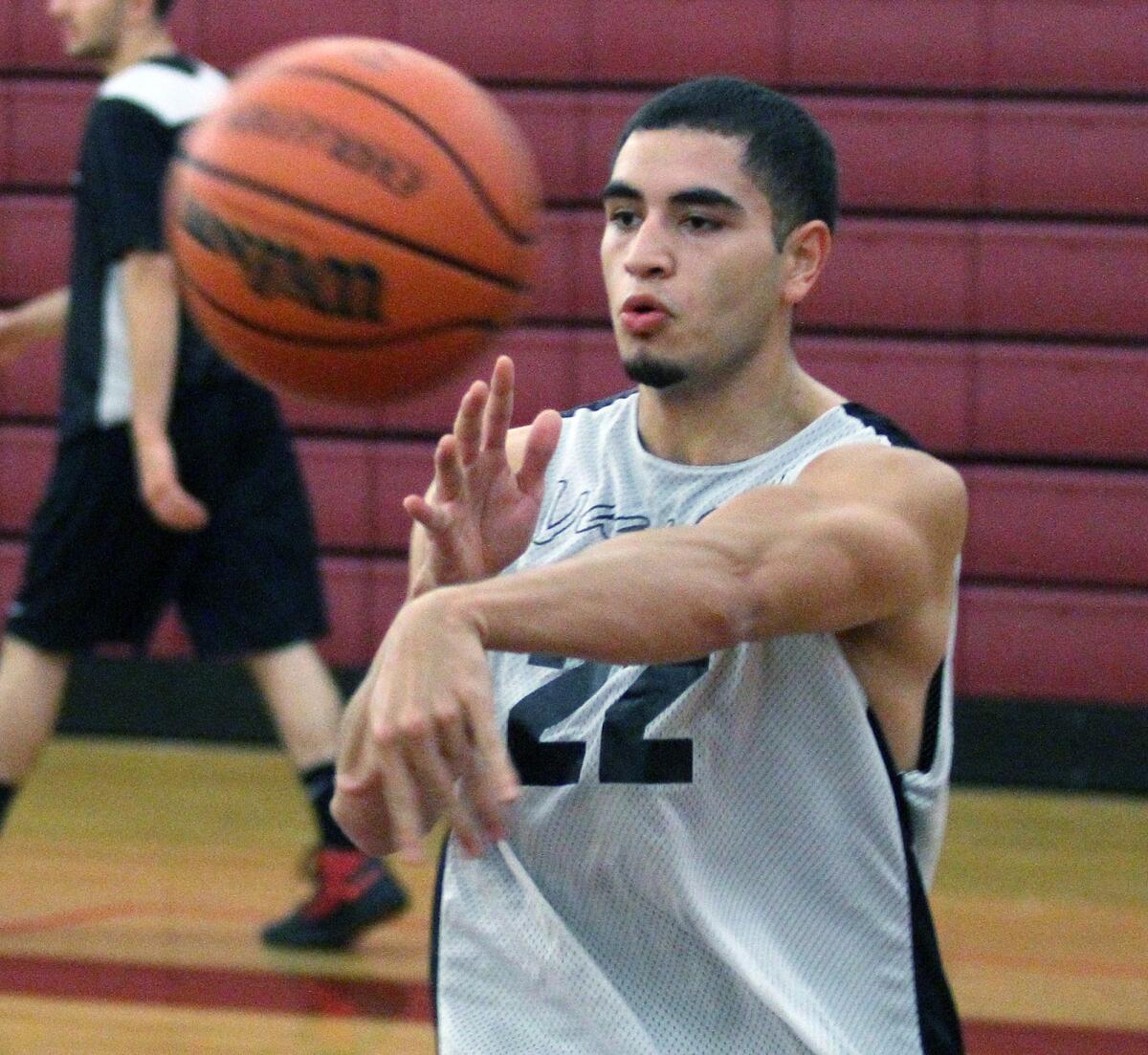 Glendale Community College's Emerson Castaneda makes a pass at practice on campus in the Verdugo Gym on Tuesday, Nov. 5, 2013.
