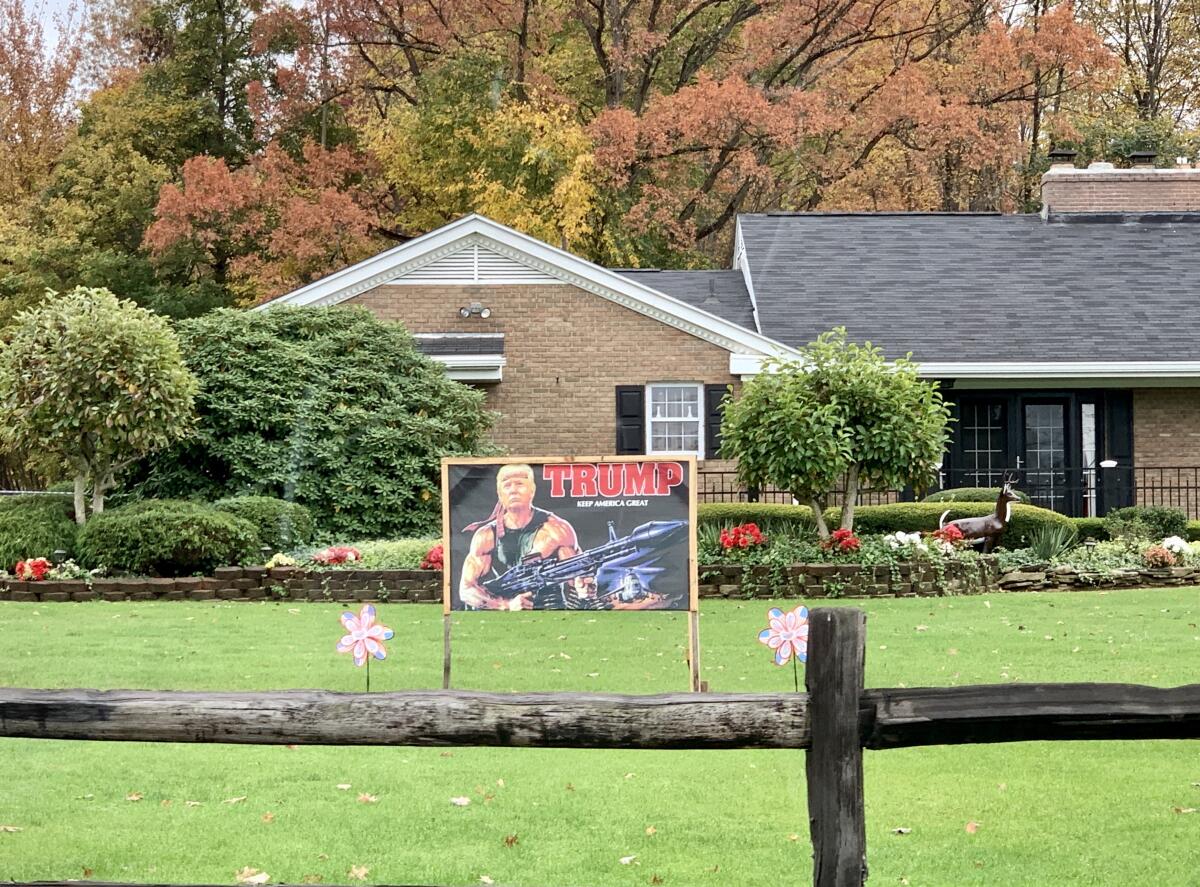 A yard sign showing Trump as an action hero