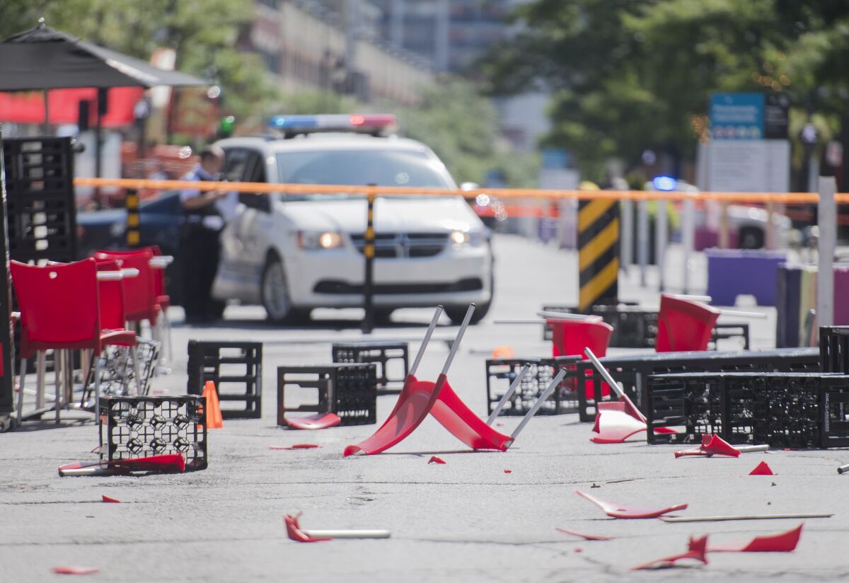 The remains of an outdoor terrace are shown after a jeep collided with it as it sped down a pedestrian zone on Sainte-Catherine Street in Montreal, Saturday, Aug. 8, 2020.