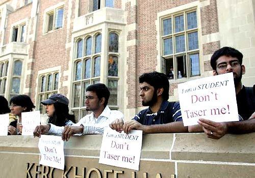 (r to l) UCLA students Fawad Shaiq, 23, Mustafa Siddiquez, 21, Rahmatullah Akbar, 23, Leyla Sahabi, 23, Sara Zabih, 22, and Ladan Sahabi, 21, join hundreds of UCLA students to protest the use of excessive force on students.
