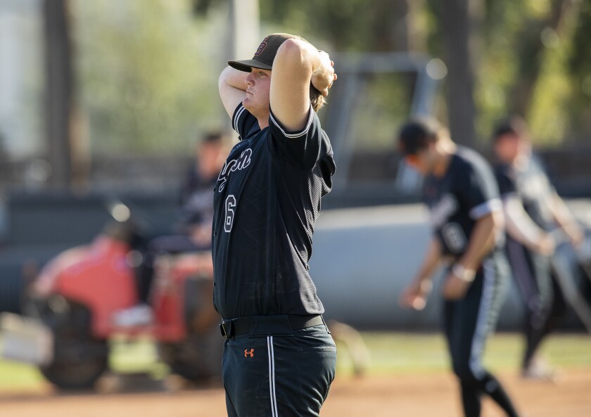 Huntington Beach pitcher Jack Smith reacts after the Oilers lose to Sherman Oaks Notre Dame on Tuesday.