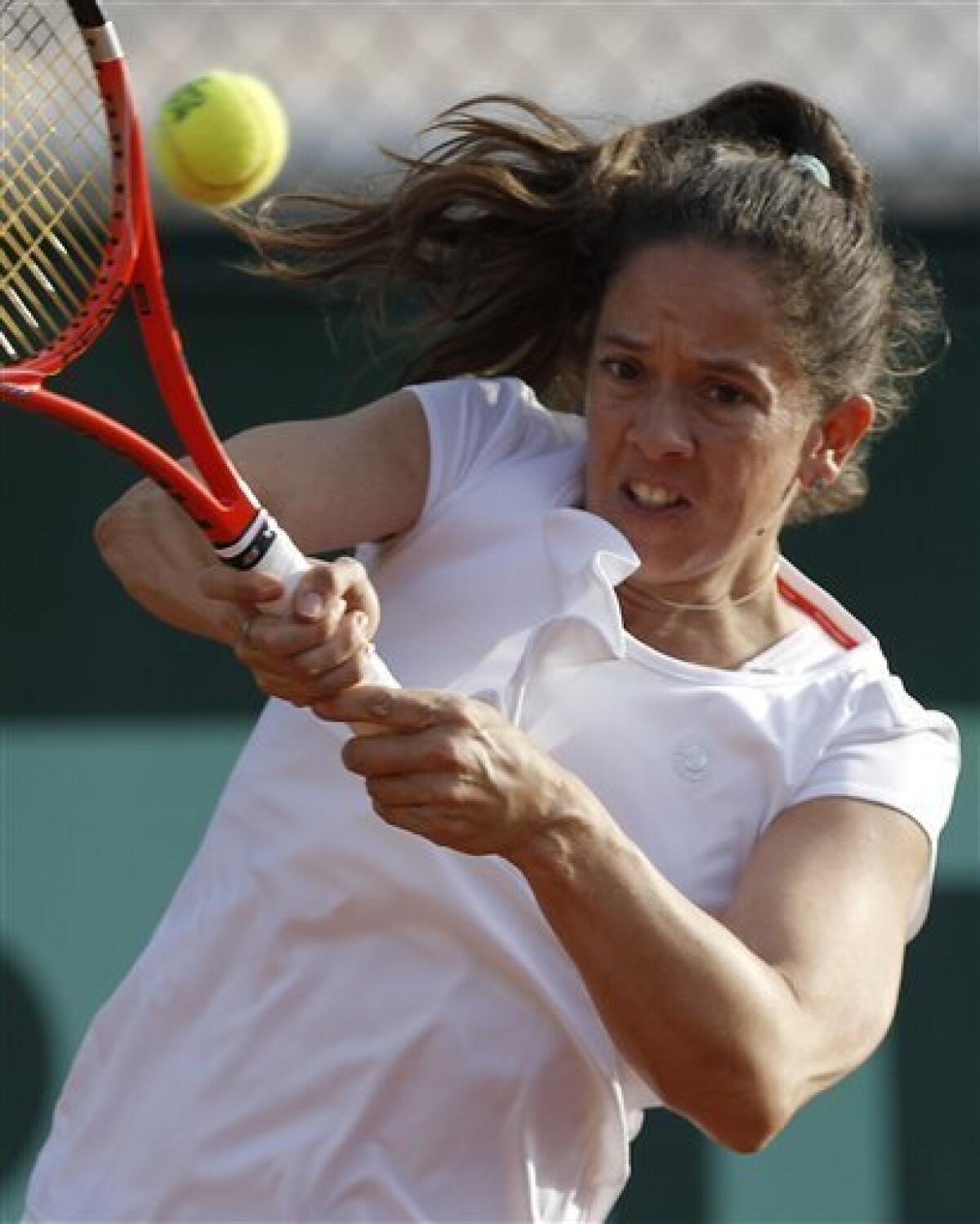 Switzerland's Patty Schnyder returns the ball to Romania's Sorana Cirstea during his first round match of the French Open tennis tournament, at the Roland Garros stadium in Paris, Tuesday, May 24, 2011. (AP Photo/Christophe Ena)