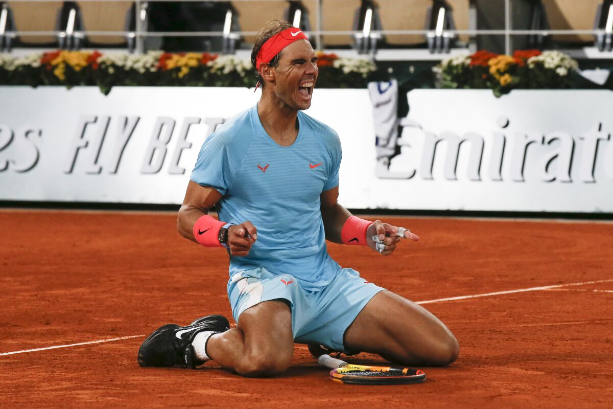 Rafael Nadal celebrates winning the final match of the French Open.