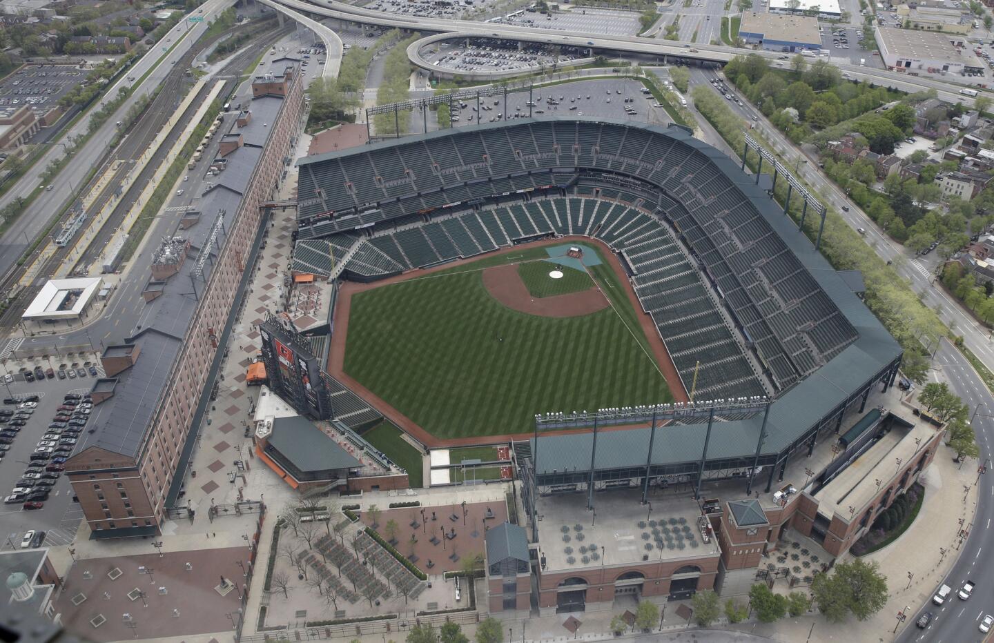 In this aerial photo, Oriole Park at Camden Yards sits empty on Tuesday in Baltimore.