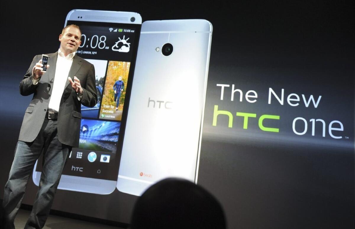 HTC President Jason Mackenzie unveils the latest HTC One smartphone in New York on Tuesday. On Friday, the Federal Trade Commission announced that HTC had agreed to settle a complaint that it failed to properly secure millions of smartphones and tablet computers against data theft.