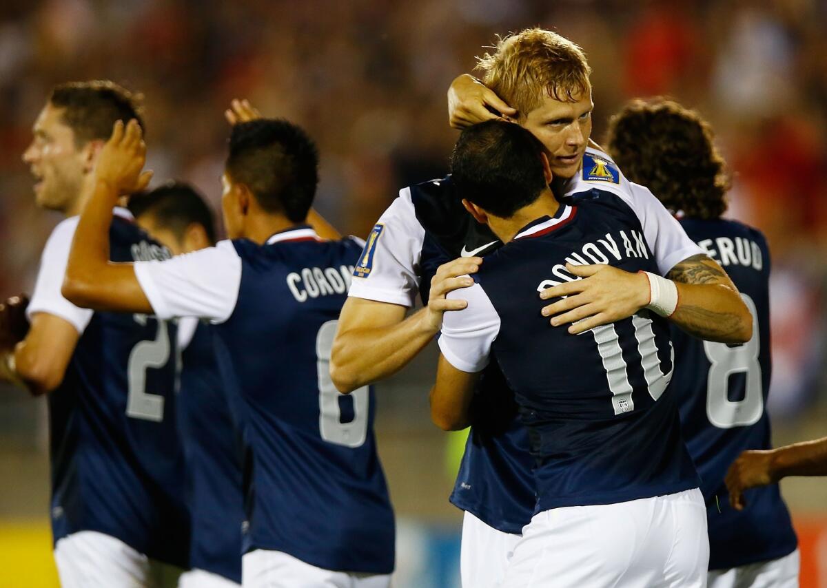 Brek Shea, top, celebrates with Landon Donovan after scoring in the United States' 1-0 Gold Cup victory over Costa Rica.