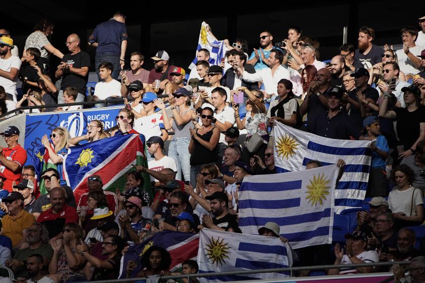 Fans attend the Rugby World Cup Pool A match between Uruguay and Namibia at the OL Stadium in Lyon, France, Wednesday, Sept. 27, 2023. (AP Photo/Laurent Cipriani)
