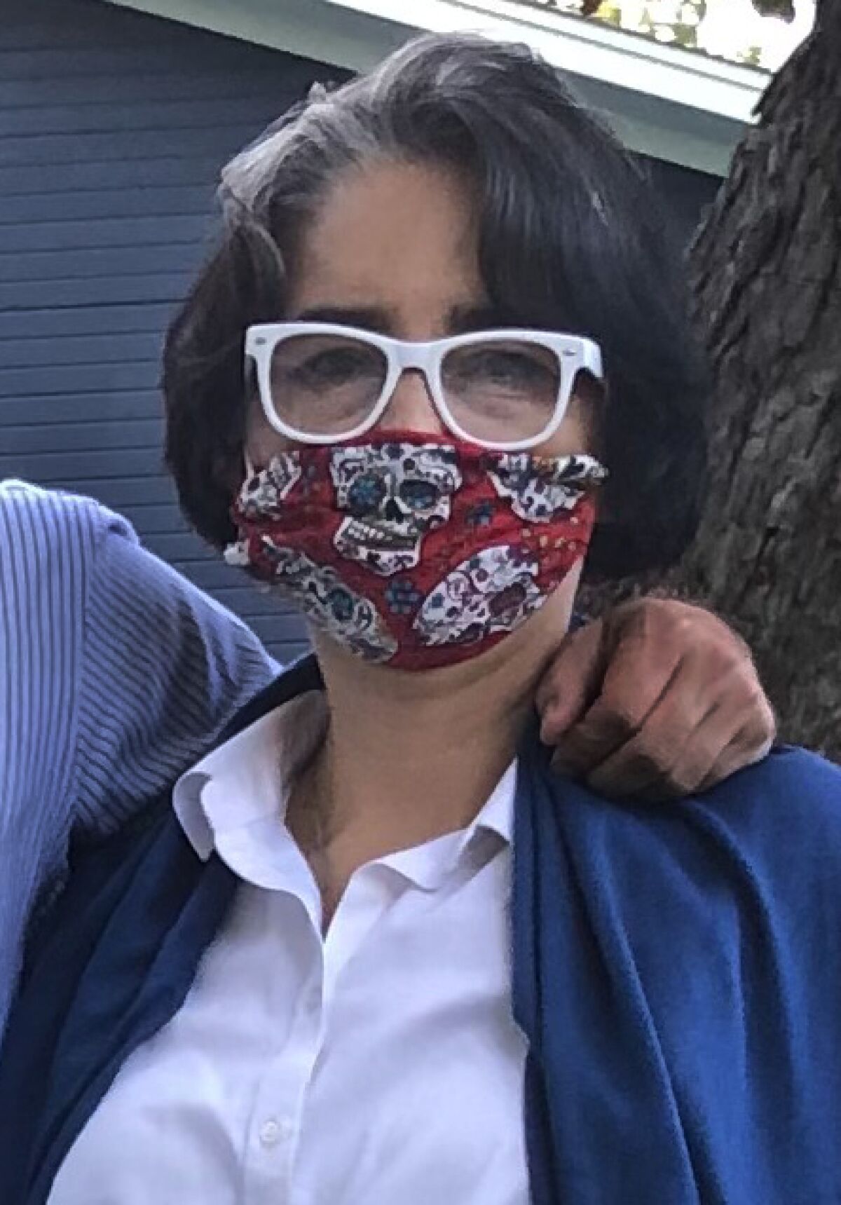 Paloma Diaz, pictured wearing a protective mask, directs Latino American studies at the University of Texas in Austin.