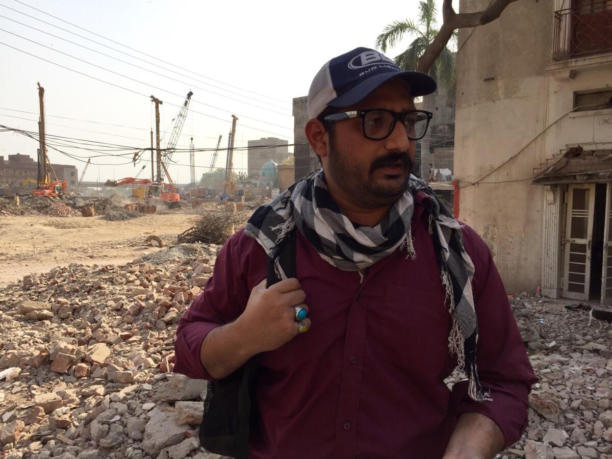 Living in the path of the Chinese-built Orange Line, Ali Rashid says, "All I see is destruction everywhere."