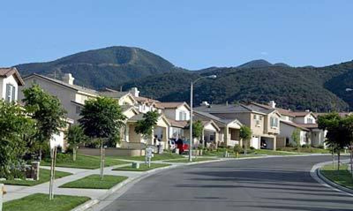 Neighborhoods in Corona have a view of the San Gabriel Mountains. Buyers are drawn to the area in Riverside County because of its new and nearly new homes that are priced lower than comparable homes in Orange County.