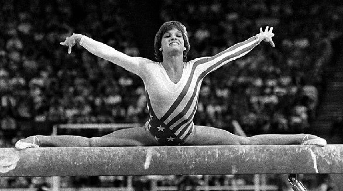 Mary Lou Retton performs on the balance beam in 1984.