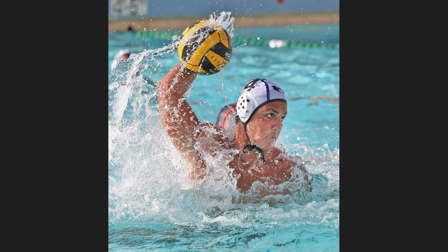 Hoover's Hayk Krikorian shoots in front of the Glendale net in a boys' water polo match at Glendale High School on Wednesday, October 18, 2017.