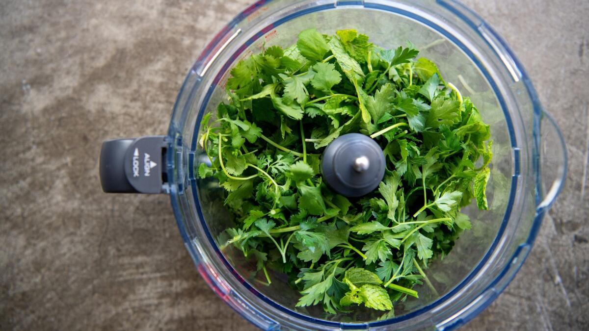 A food processor can finely chop herbs quickly. A sharp knife works well too.