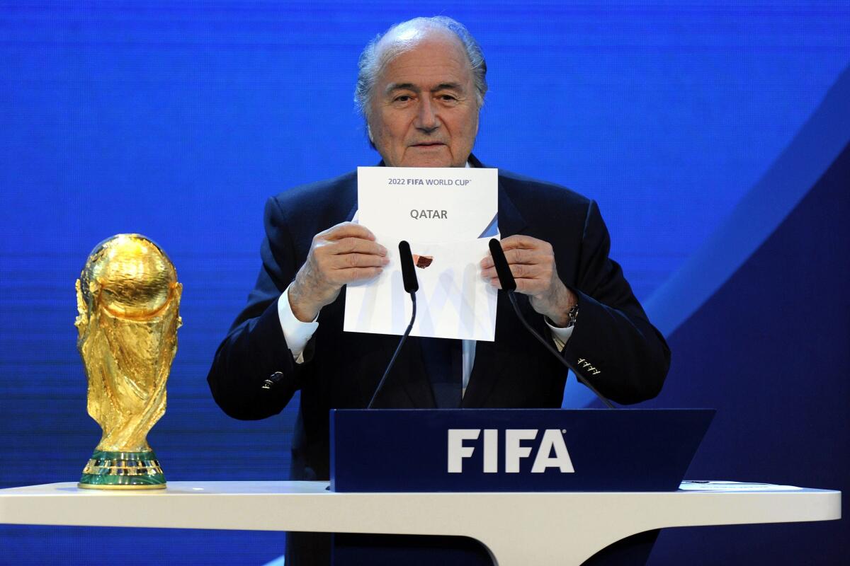 FILE - FIFA President Joseph S. Blatter announces that Qatar will be hosting the 2022 Soccer World Cup, on Thursday, Dec. 2, 2010, during the FIFA 2018 and 2022 World Cup Bid Announcement in Zurich, Switzerland. Former FIFA president Sepp Blatter said on Tuesday, Nov. 8, 2022, that picking Qatar to host the World Cup was a mistake 12 years ago(AP Photo/Keystone/Walter Bieri, File)